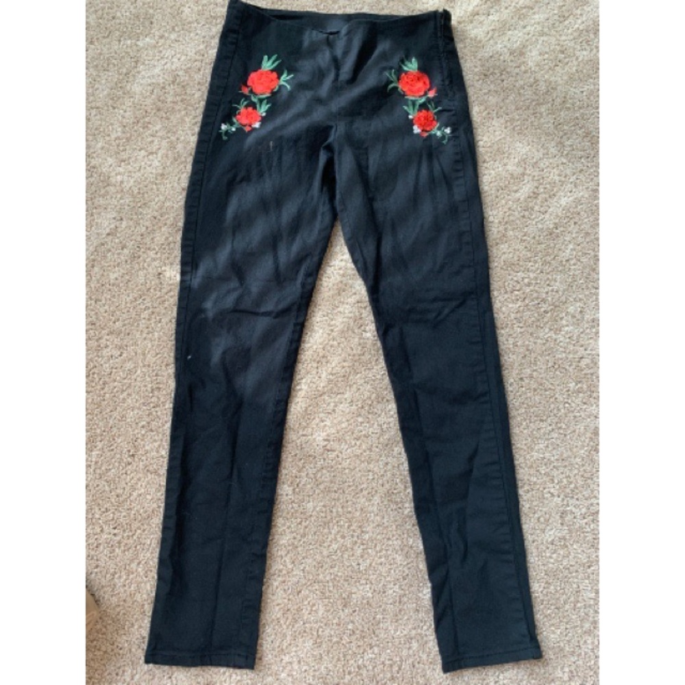Black pants with red rose detailing